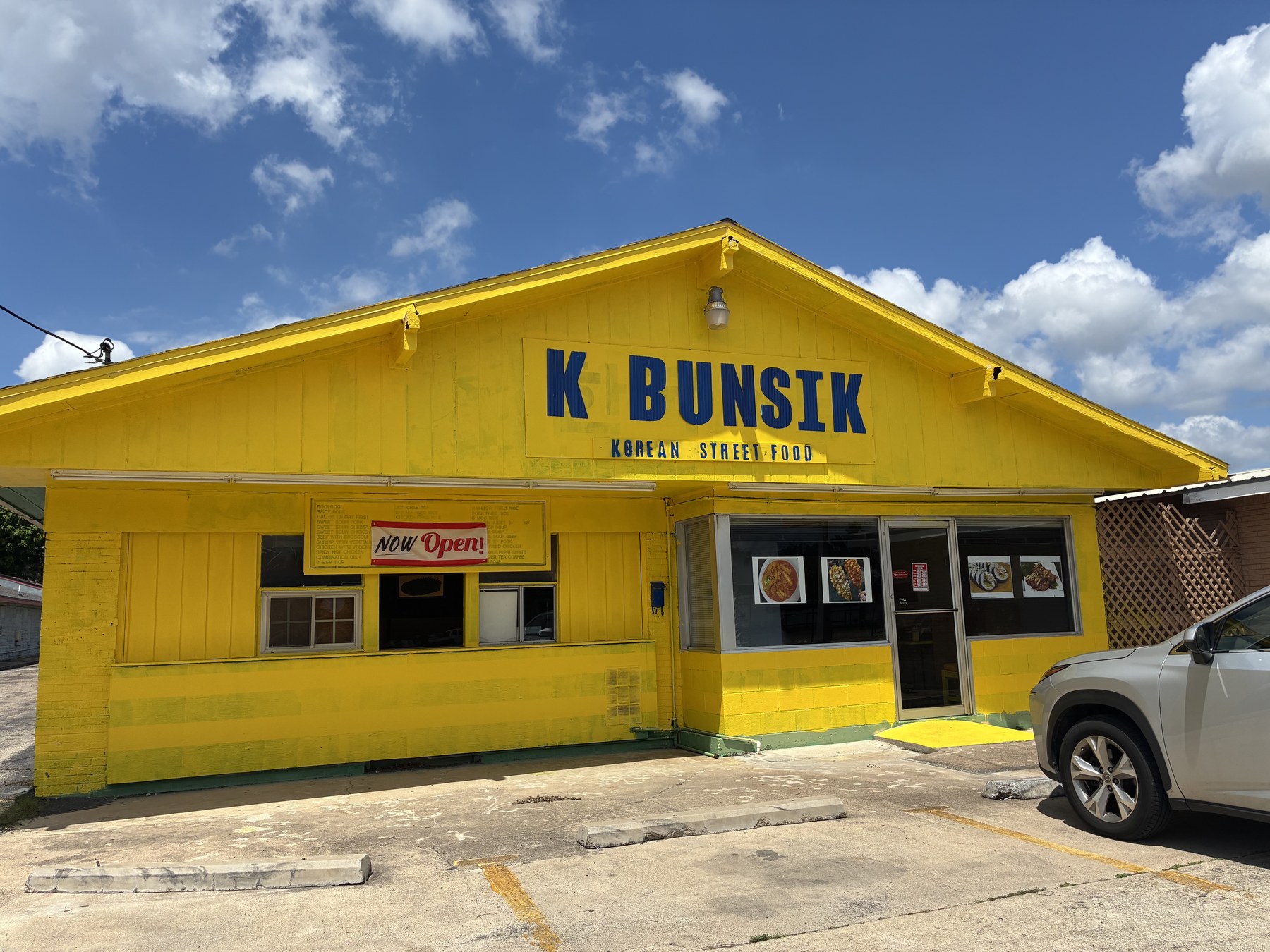The bright butter-yellow exterior of K Bunsik in Killeen, Texas